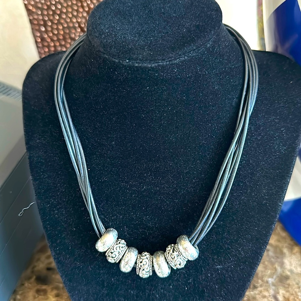 Brighton necklace six black leather cords seven silvertone charms gorgeous clasp